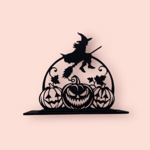 Halloweenska dekorácia s čarodejnica na metle